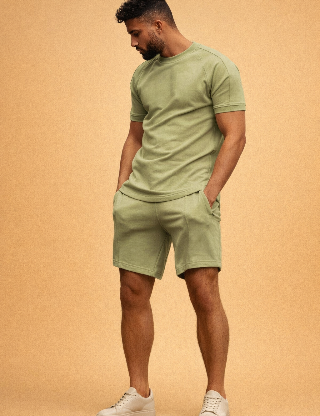 Olive green short sleeve fitted t-shirt paired with matching olive green tailored shorts in smooth cotton fabric with clean seams and minimal design