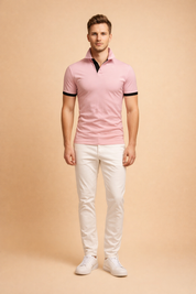 Slim fit pink polo shirt with black contrast collar and sleeve cuffs, short sleeves, smooth cotton blend fabric, tailored silhouette, and clean button placket for a modern smart casual look