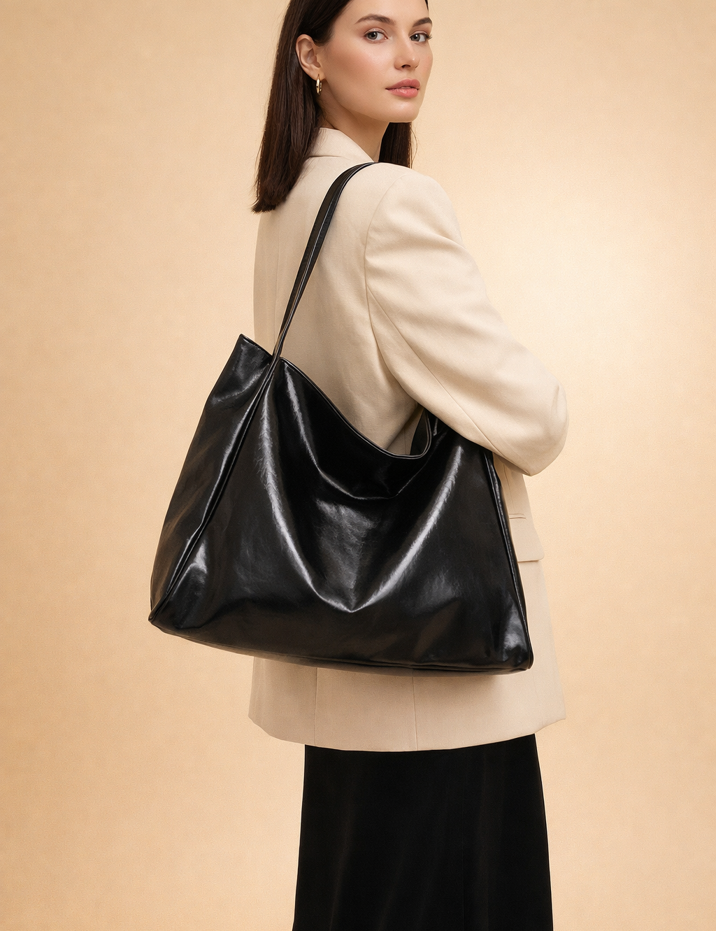 polish-female-model-wearing-black-leather-shoulder-bag-studio-pose.png