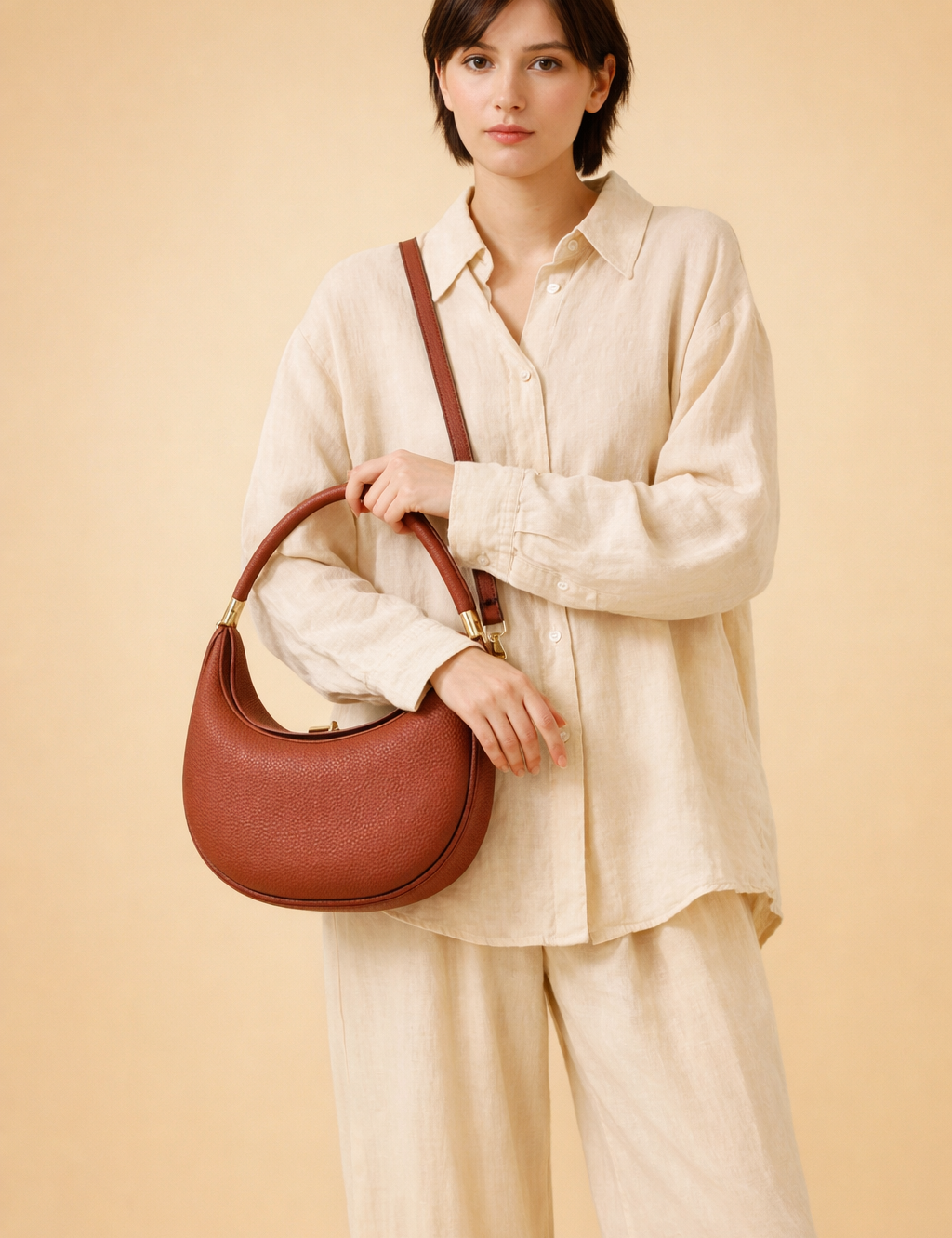 polish-female-model-wearing-brown-leather-hobo-bag-studio-pose.png