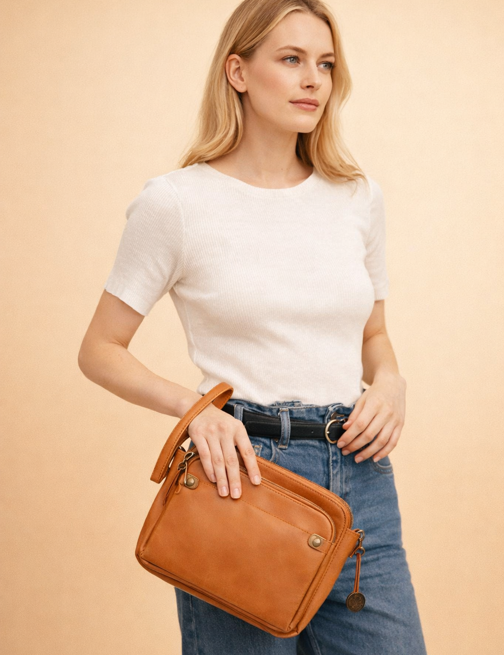 polish-female-model-wearing-cognac-leather-crossbody-bag-studio-shot.png