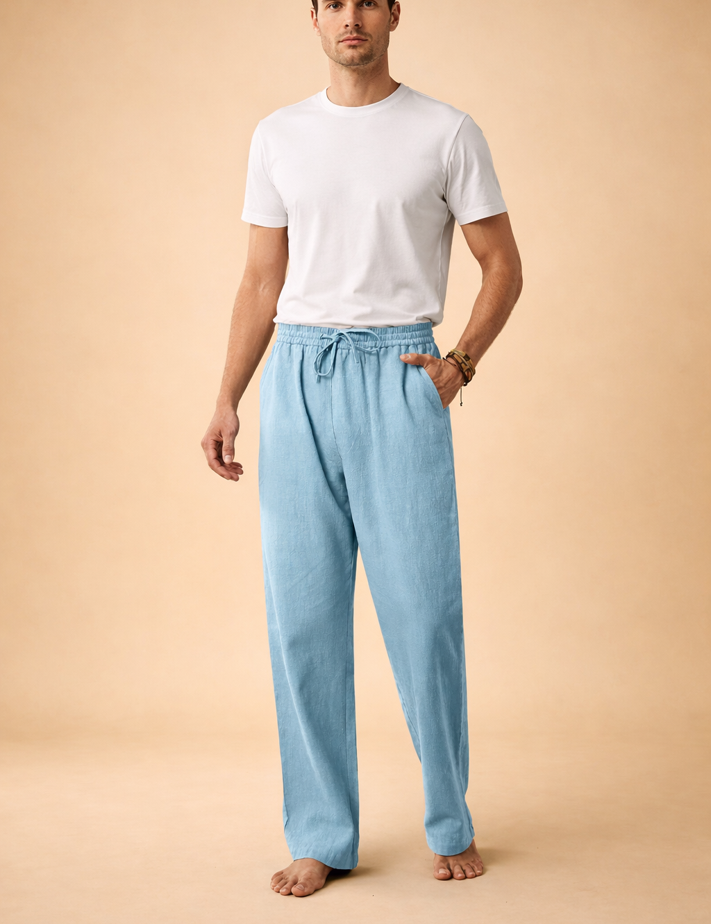 Relaxed men’s drawstring trousers with a straight-leg cut, elasticated waistband, adjustable tie detail, and fluid drape, designed for a clean modern silhouette and everyday wear.