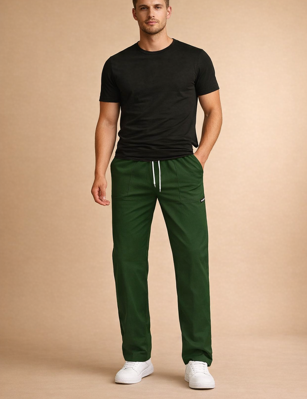 Relaxed-fit men’s green drawstring pants with a clean straight-leg cut, elastic waistband, subtle seam detailing, and minimal branding, styled with low-profile white sneakers for a modern casual look.