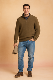 Beige ribbed half-zip pullover sweater layered over plaid shirt paired with blue jeans, showcasing textured knit pattern and casual style