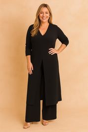 Elegant black coord set featuring a V-neck long tunic with a center slit, styled over matching wide-leg trousers in smooth, structured fabric.