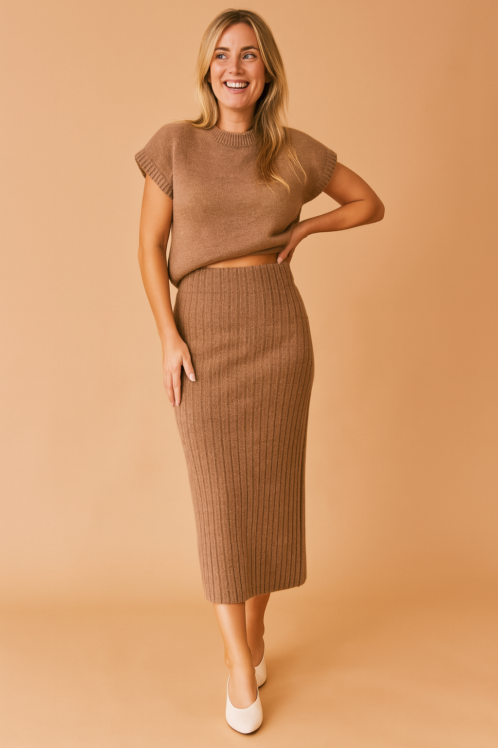 Brown ribbed knit co-ord set featuring a cap-sleeve cropped sweater and high-waisted midi pencil skirt in matching textured fabric.

