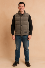 Men’s stylish gray padded winter vest with front snap buttons, quilted design, and practical side pockets, perfect for layering in cold weather.