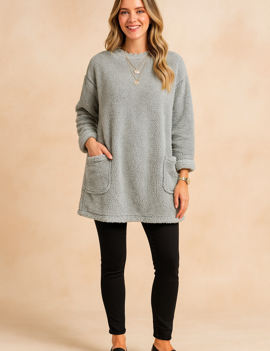 Long oversized sweater with a fluffy, plush texture, featuring two practical front pockets and a simple, comfortable fit.