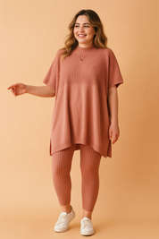  Ribbed knit co-ord set featuring an oversized tunic top and matching fitted leggings in a vintage old rose tone, styled with a high neckline and short sleeves.