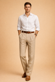 Tailored beige pleated trousers styled with a crisp white long-sleeve button-up shirt, finished with a brown leather belt and classic brown leather dress shoes for a refined modern look.