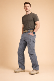 Black tactical cargo trousers with a straight-leg cut, reinforced knee panels, articulated seams, secure flap cargo pockets on the thighs, classic side pockets, and a structured waistband with belt loops for a clean utility-inspired finish.