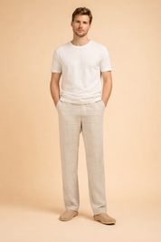 Men’s tailored straight-leg trousers with a relaxed fit, clean front construction, side pockets, and full-length legs styled with minimalist slip-on shoes for a refined everyday look.
