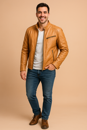 Slim-fit tan leather moto jacket with asymmetric chest zipper and snap collar, styled with clean seam detailing and vertical side pockets.