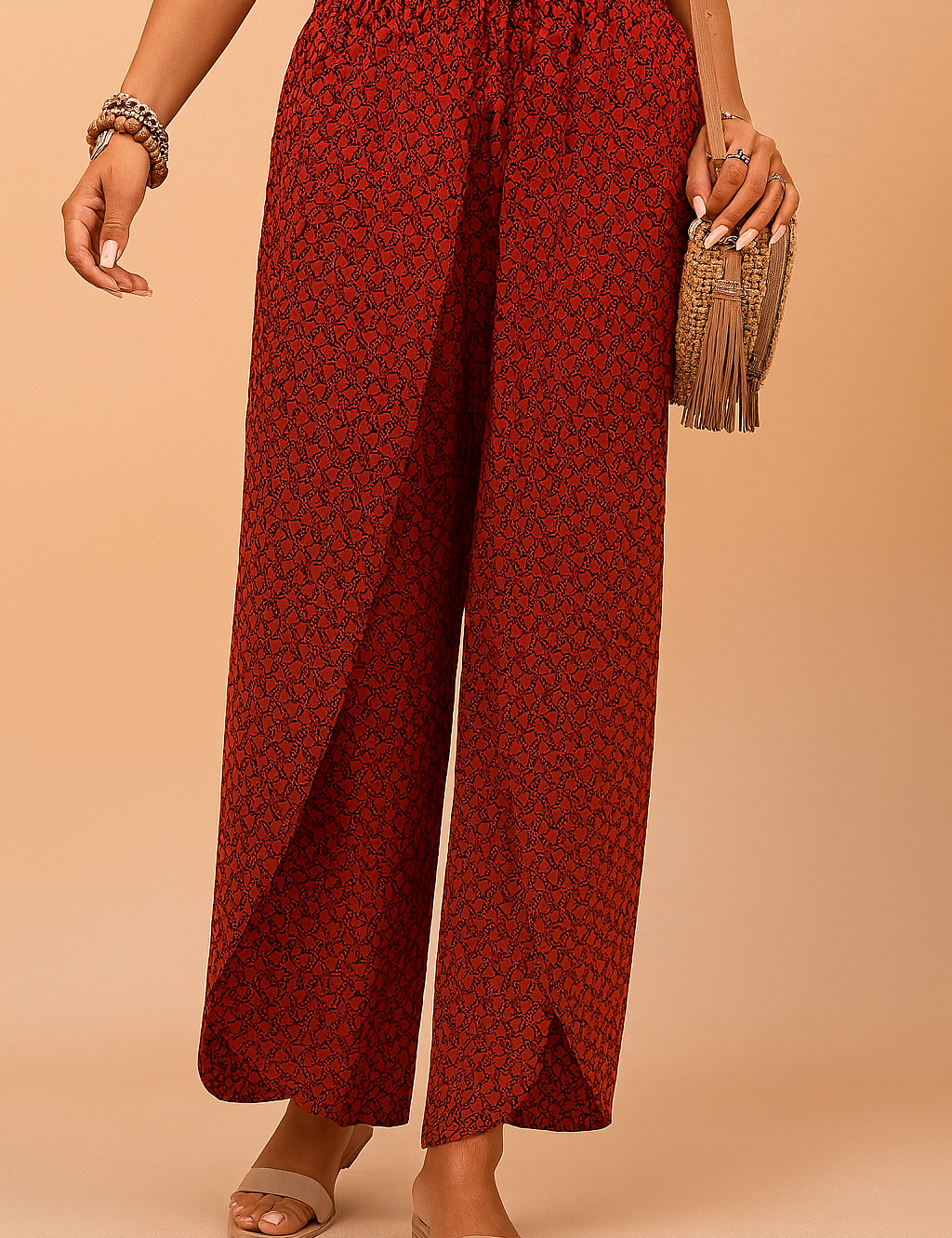 High-waisted red wide-leg pants with a black herringbone-style geometric pattern, featuring an elastic waistband and front drawstring in matching fabric, made from lightweight woven material with a natural drape.