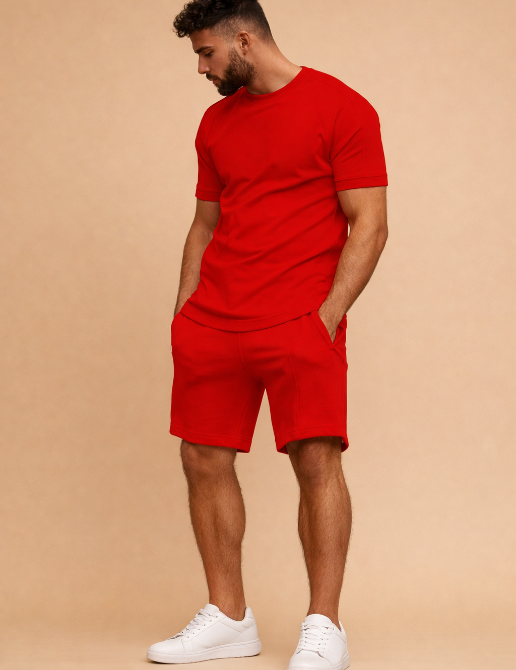 Red matching short sleeve t shirt and shorts set with smooth fabric finish, relaxed tailored fit, elastic waist shorts, and clean minimalist design