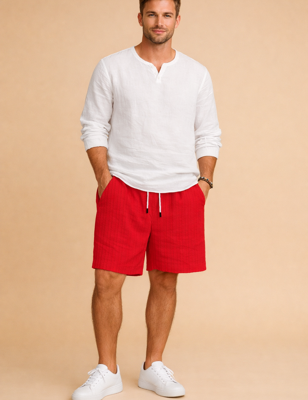 Red ribbed summer shorts with an elastic drawstring waist and side pockets, styled with a clean white long-sleeve shirt and minimalist low-profile sneakers for a refined casual look, showcasing the exact ribbed fabric texture, precise red color shade, and original cut of the shorts.