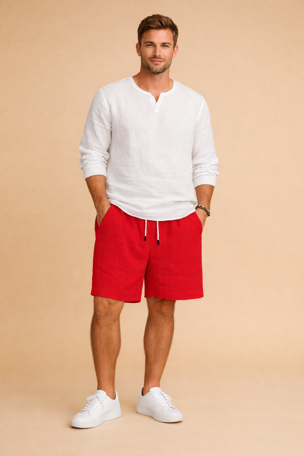 Red ribbed summer shorts with an elastic drawstring waist and side pockets, styled with a clean white long-sleeve shirt and minimalist low-profile sneakers for a refined casual look, showcasing the exact ribbed fabric texture, precise red color shade, and original cut of the shorts.
