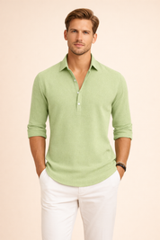 Long-sleeve relaxed-fit shirt with a clean open collar, subtle textured weave, three-button placket, softly draped silhouette, neatly finished cuffs, and a smooth straight hem paired with tailored lightweight trousers.