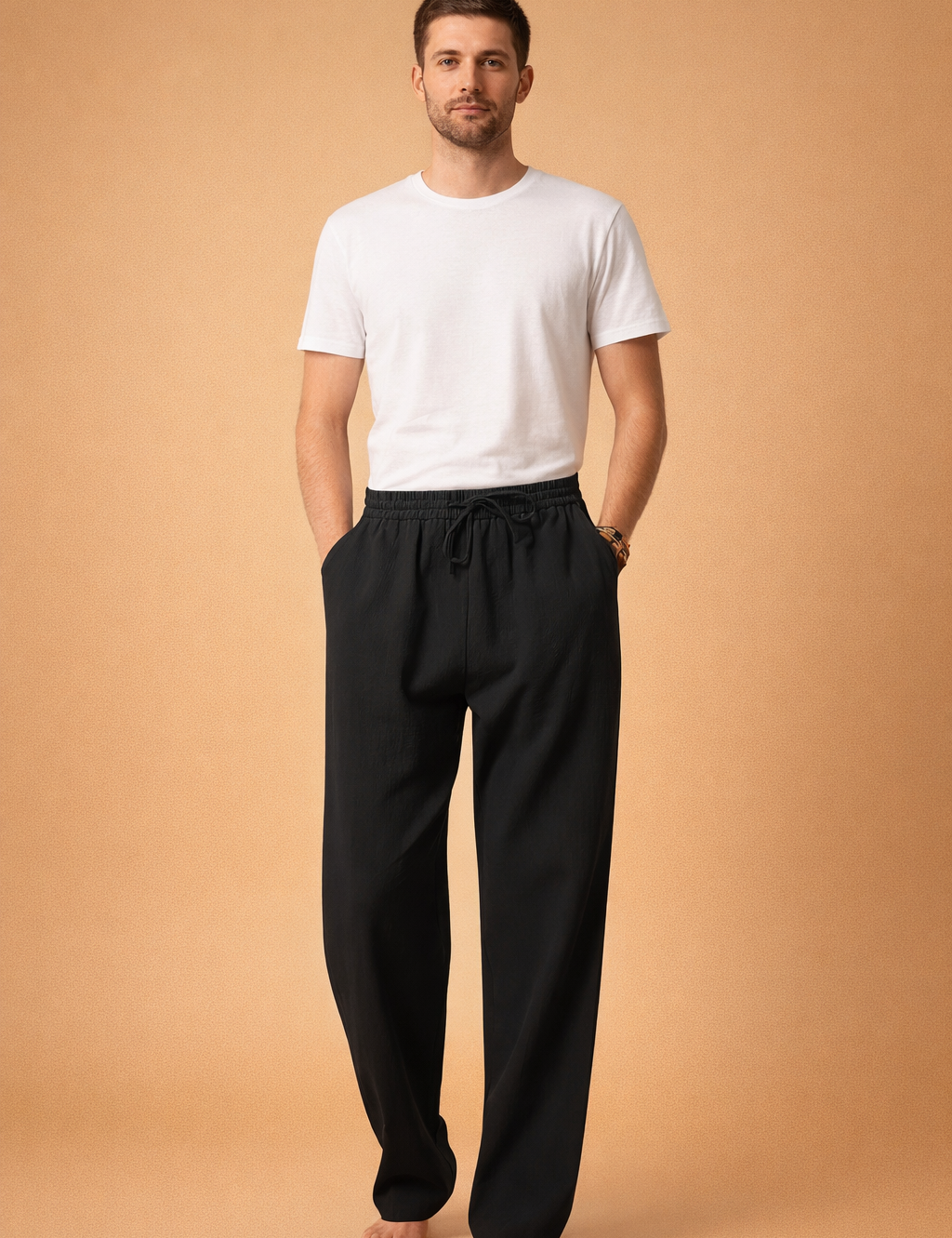 Light blue linen drawstring trousers with a relaxed straight-leg cut, elastic waistband with adjustable tie, soft textured fabric, and full-length drape paired with a clean white short-sleeve crew-neck T-shirt.