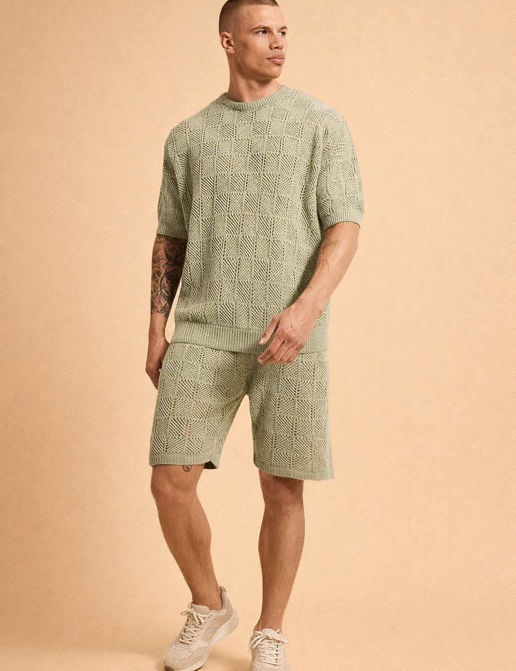 Sage green knitted short-sleeve sweater and matching knit shorts set featuring an all-over geometric openwork pattern, ribbed crew neckline, ribbed sleeve cuffs, ribbed hem, elastic waistband shorts, breathable textured fabric, and coordinated relaxed-fit summer knit co-ord design