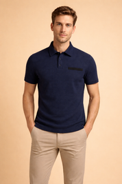 Textured short-sleeve polo top with structured collar, three-button placket, subtle chest pocket detail, and tailored fit, styled with straight-cut chinos for a refined casual look.