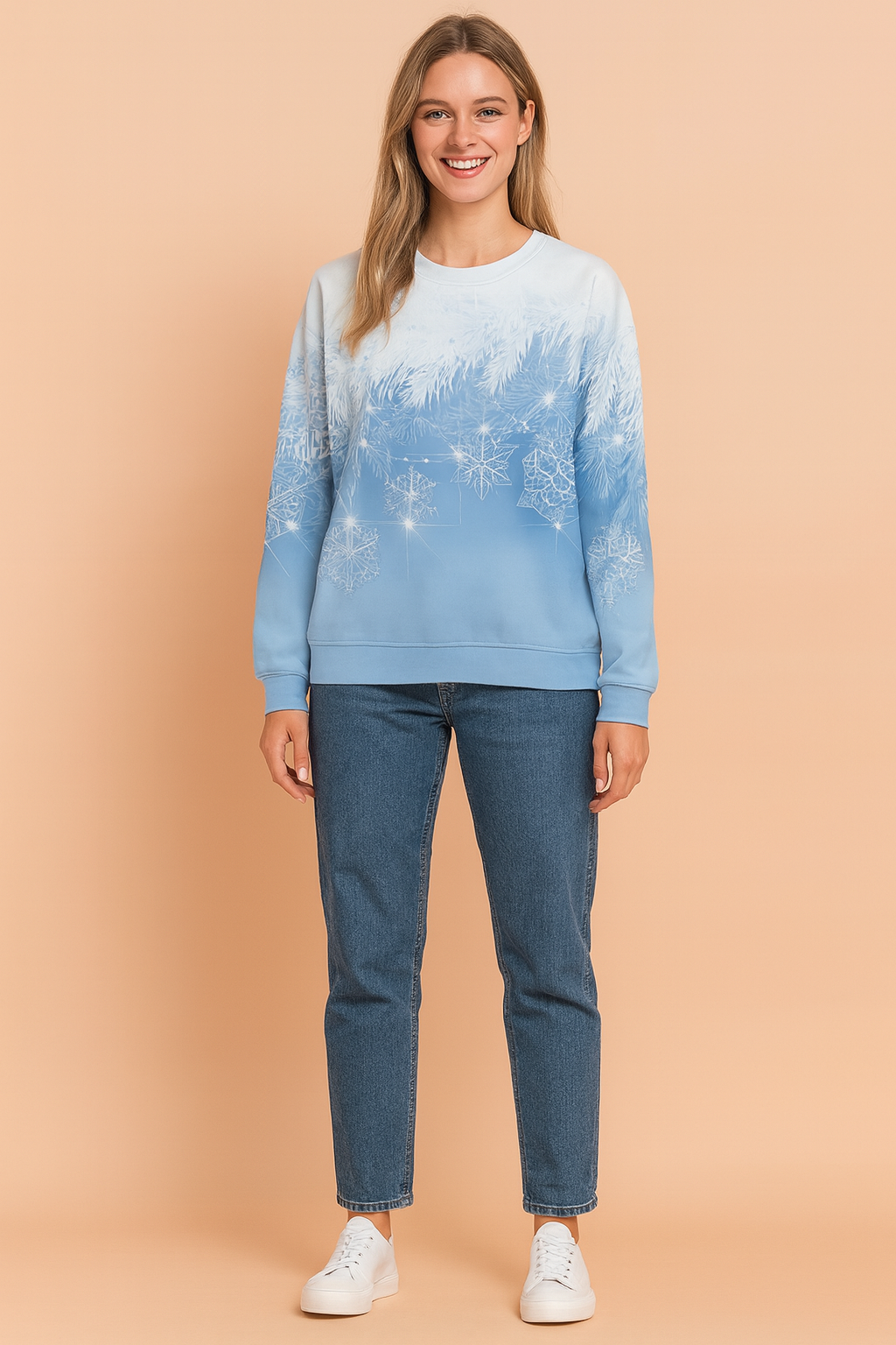 Light blue gradient sweatshirt with white frosted pine branch and snowflake print, paired with mid-wash straight-leg jeans and white lace-up sneakers.