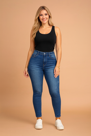 Women’s high-waisted jeggings in classic blue denim wash with subtle fade details, slim-fit cut, faux front pockets, and stretch comfort fabric for an everyday stylish look.