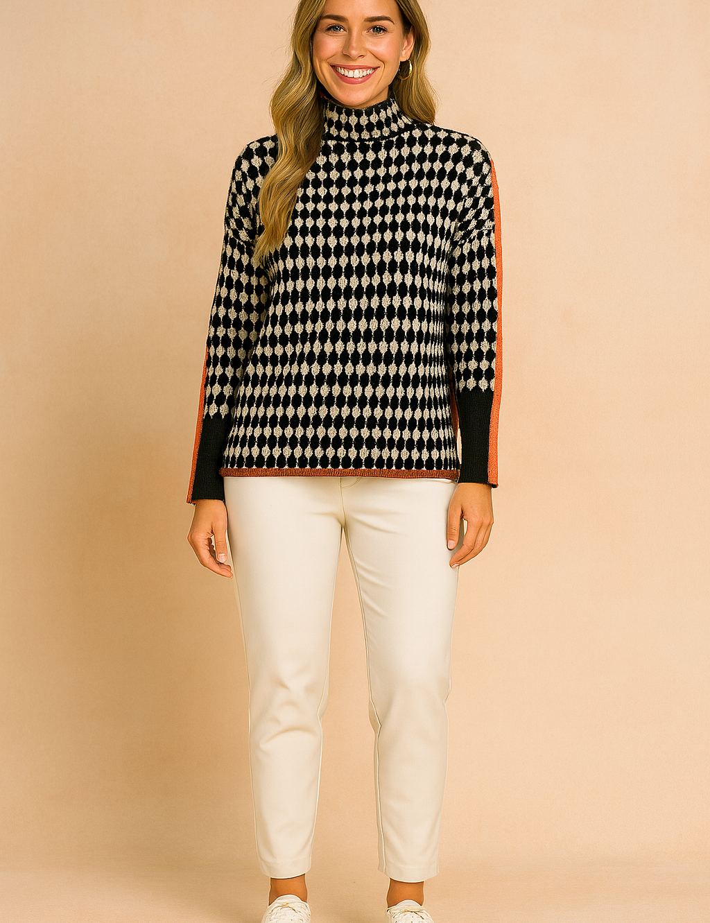 Oversized houndstooth turtleneck sweater with bold orange stripe detailing on sleeves, paired with black jogger pants and white sneakers.