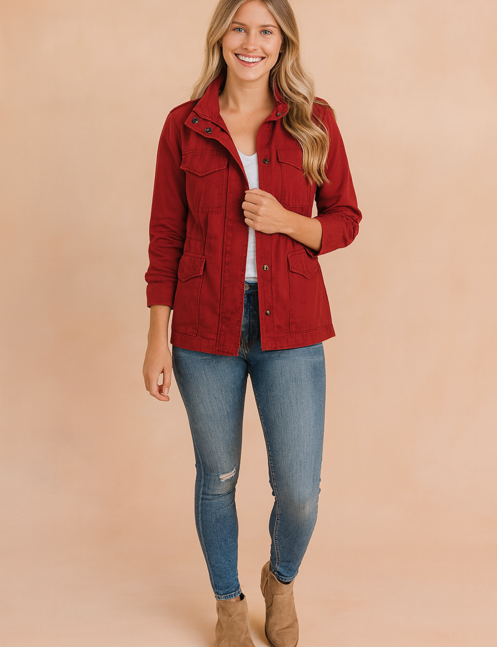 Women’s red casual utility jacket with front zipper, snap buttons, chest and side pockets, styled with jeans and ankle boots.